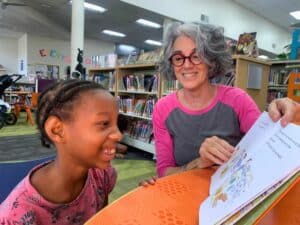 Da’myla reading with Joan at Library reading with Joan at Library.